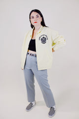 long sleeve light yellow zip up sport jacket with crest on left chest vintage 1970's