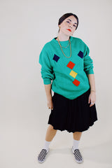 long sleeve kelly green pullover sweater with navy, yellow, and red diamond pattern vintage 1980's
