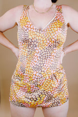 sleeveless one piece bathing suit in pink orange and yellow paisley print with skirt over bottom vintage 1970's