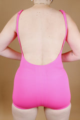 hot pink vintage 1960's one piece swimsuit with adjustable straps and skirt in front 