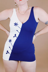 navy and cream two tone vintage 1960's one piece bathing suit with floral detail and skirt in front 