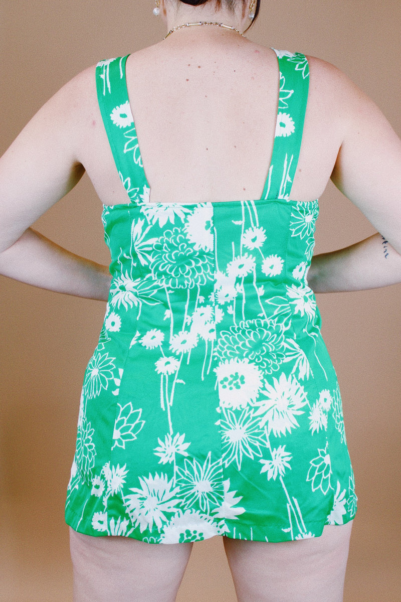 sleeveless vintage 1960's one piece swimsuit with skirt over bottoms in front and back green with white floral print