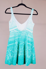 green and white printed one piece vintage 1960's swimsuit with full skirt