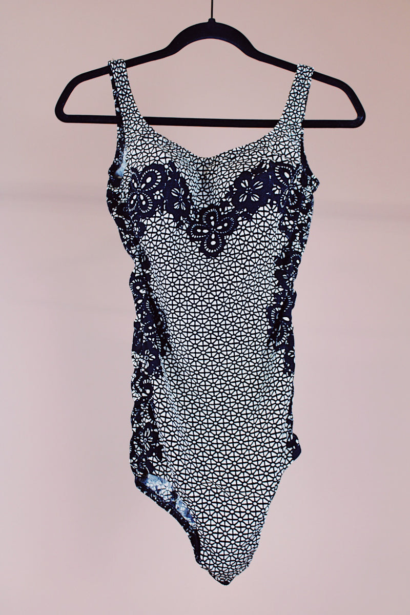 black and white vintage 1960's one piece swimsuit in a lace looking print