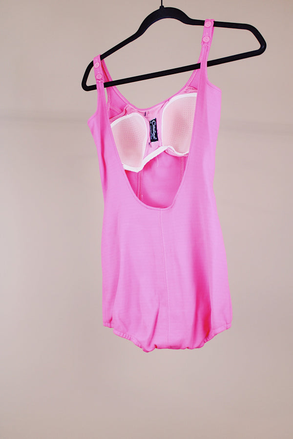 hot pink vintage 1960's one piece swimsuit with adjustable straps and skirt in front 