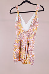 sleeveless one piece bathing suit in pink orange and yellow paisley print with skirt over bottom vintage 1970's