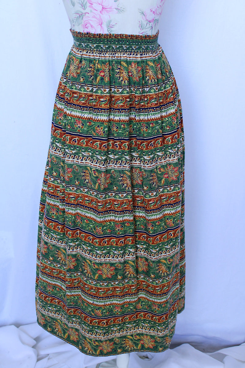 Women 's vintage 1970's cotton lightweight ankle length maxi skirt in all over green and brown abstract print. 
