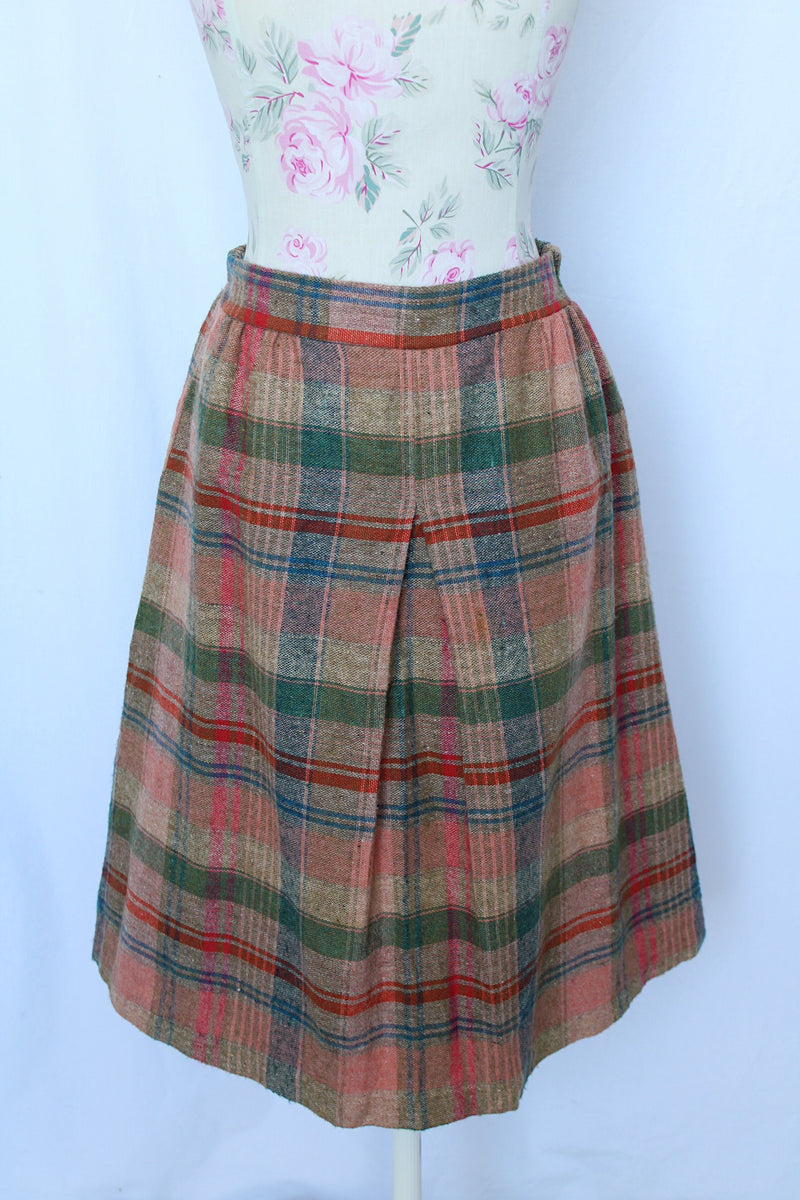 Women's vintage 1970's Pretty Plus label plaid print knee length pencil skirt with elastic waistband in a wool blend material.