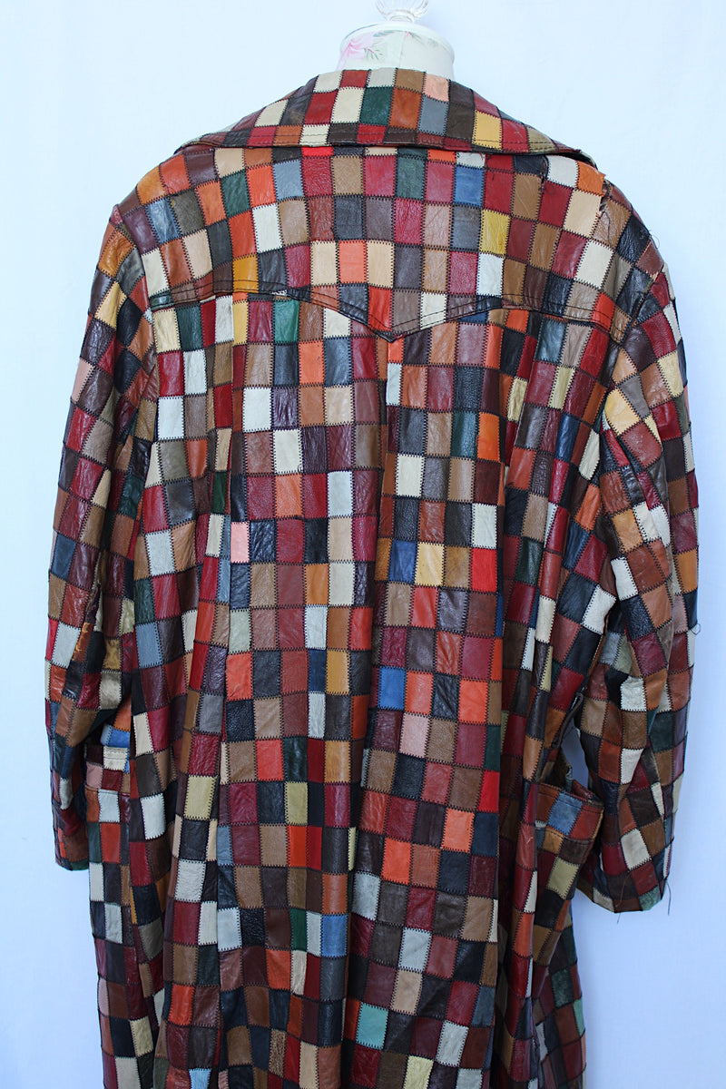 Women's or men's vintage 1970's long sleeve long length leather patchwork jacket with multicolored patchwork squares. 
