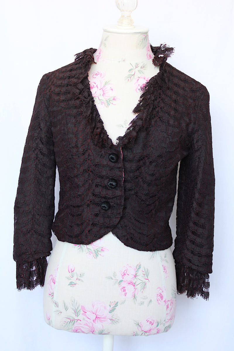 Women's vintage 1960's Charles F. Borg, Portland, Oregon label long sleeve black lace button up lace blouse with ruffle lace trim. 