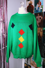long sleeve kelly green pullover sweater with navy, yellow, and red diamond pattern vintage 1980's