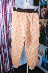 light tan quilted nylon military liner pants with brown trim popper closure vintage 1950's