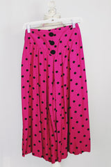 Women's vintage 1980's top and capris matching set in magenta with black polka dots. Capris has elastic waistband. Top is cropped with double breasted closure.