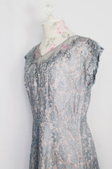 Women's vintage 1950's capped sleeved midi length lace fancy dress. Fully lined in lilac polyester with baby blue lace overlay. 