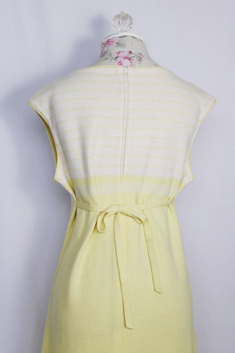 Women's vintage 1970's Jantzen, Made in USA label sleeveless midi length soft acrylic dress in baby yellow with white and yellow stripes across chest.