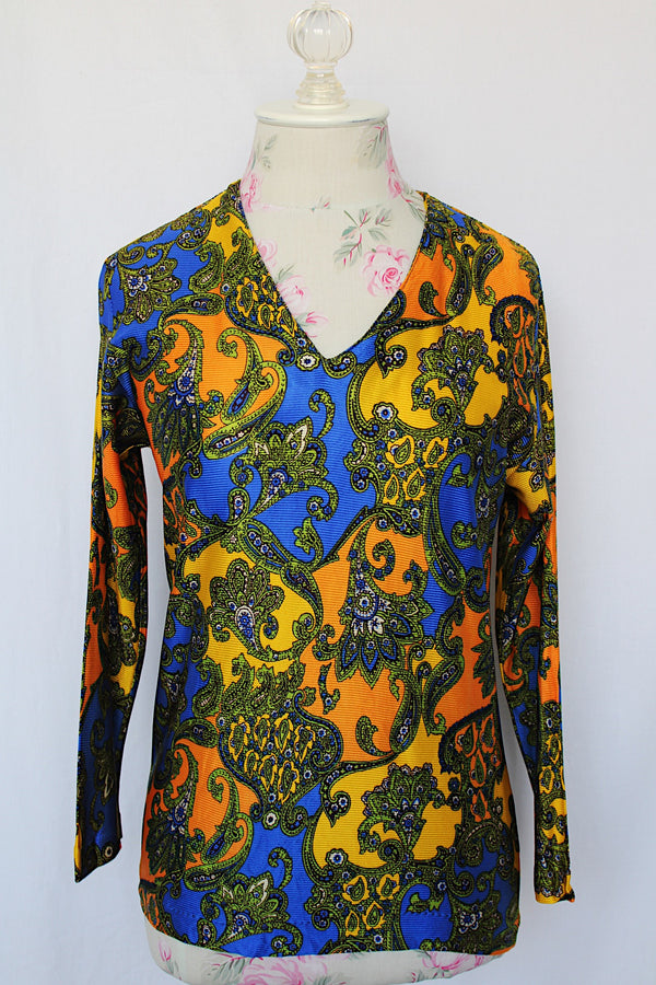 Women's vintage 1970's long sleeve all over paisley print blouse with V shaped neckline in slinky polyester material.