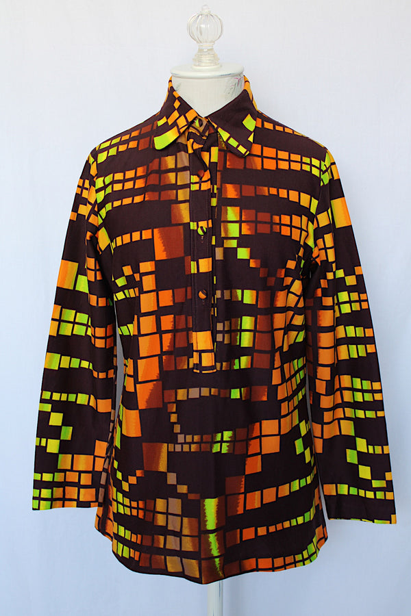 Women's vintage 1970's Styled by Terry, Chicago label long sleeve blouse with half button closure in the front and a rounded collar.