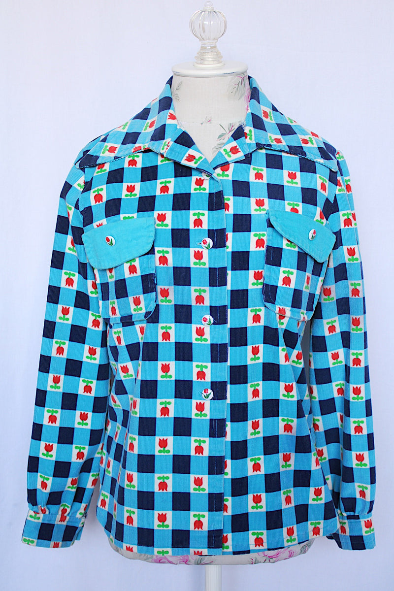 Women's vintage 1970's long sleeve button up corduroy blouse with collar. Blue and navy checkered gingham print with small roses.