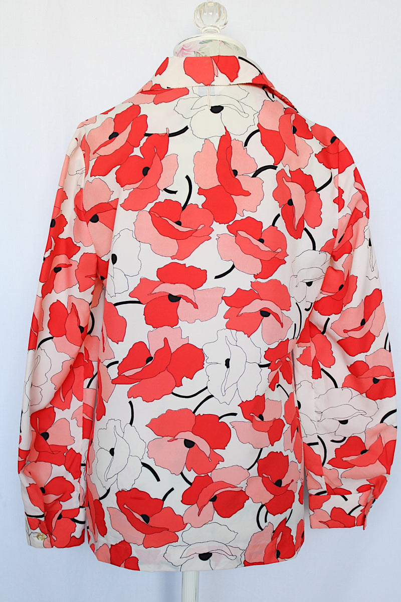 Women's vintage 1970's Sears Fashions label long sleeve button up blouse with pointy collar and darted bust. Polyester material in white with all over red and pink poppy floral print. 