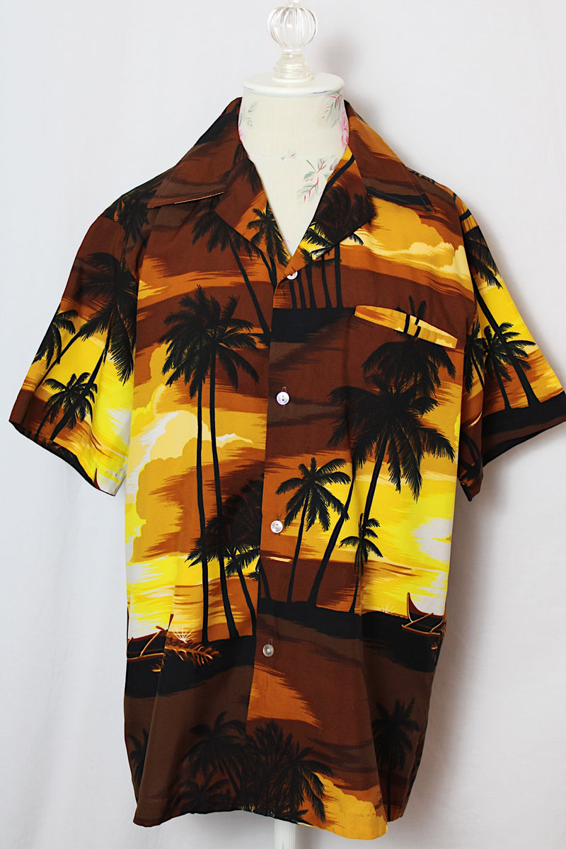 Men's or women's vintage 1970's Kai Nani Hawaii short sleeve button up shirt with double lapel in lightweight polyester in brown and yellow all over Hawaiian print. 