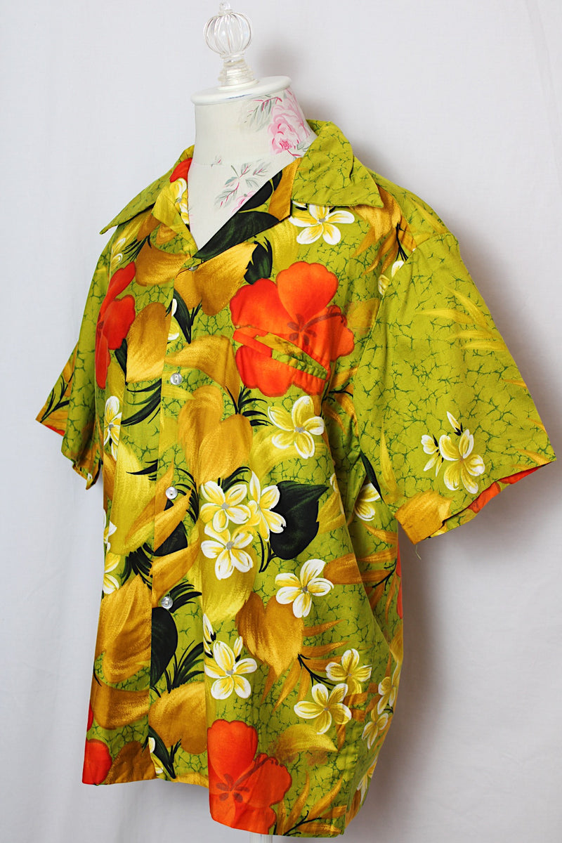 Women's or men's vintage 1970's Sears Hawaii label short sleeve Cotton material all over green Hawaiian print button up shirt with one chest pocket and double lapel. 