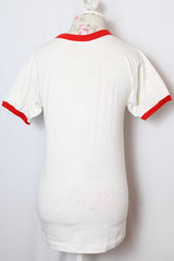 Women's or men's vintage 1970' Champion label short sleeve white tee with red trim around cuffs and neck. Stanford University graphic on the front.