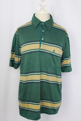 Women's or men's vintage 1980's Munsingwear, Made in USA label short sleeve green striped polo t-shirt with collar and half button closure. Polyester cotton blend. 