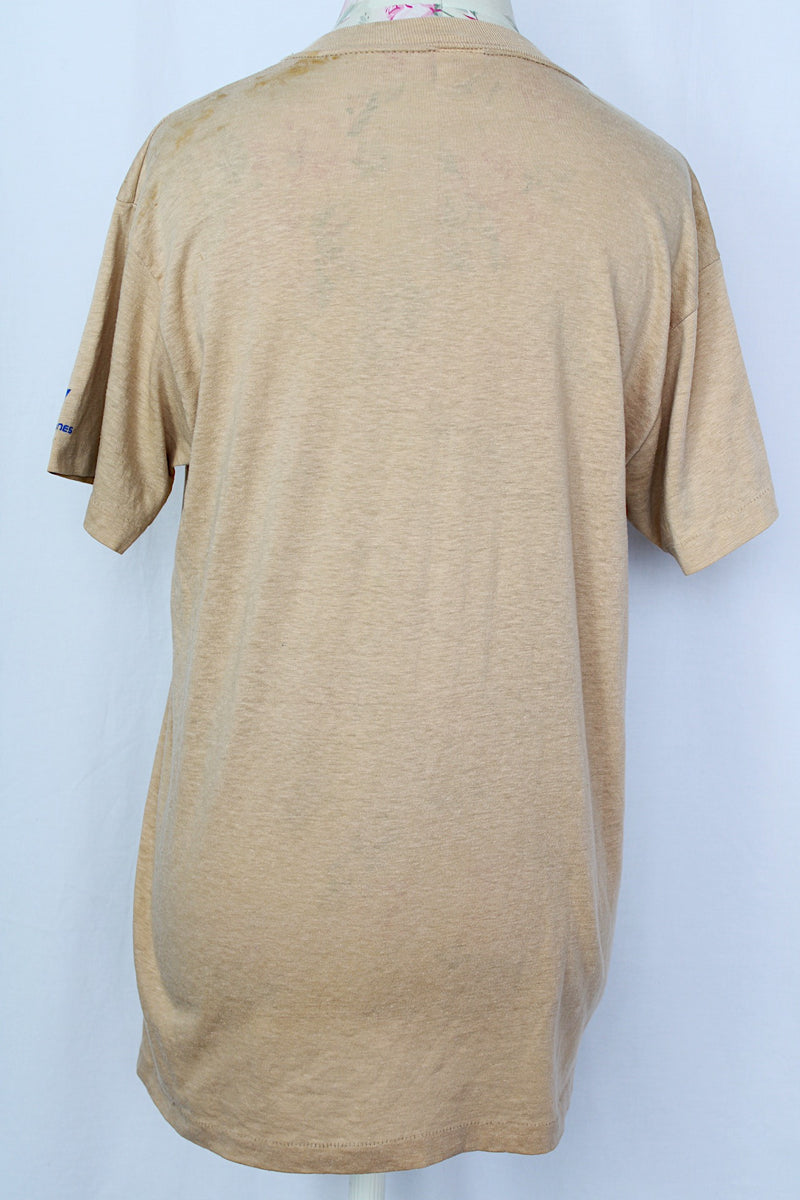 Women's or men's vintage 1970's Sport-T label short sleeve tan colored t-shirt with brown and blue graphic on the front.