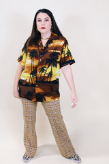 Men's or women's vintage 1970's Kai Nani Hawaii short sleeve button up shirt with double lapel in lightweight polyester in brown and yellow all over Hawaiian print. 