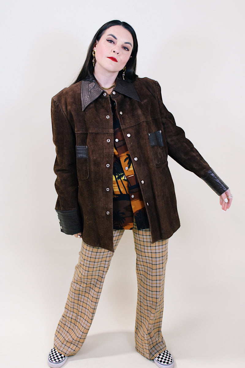 Women's or men's vintage 1970's Montgomery Ward label long sleeve brown suede jacket with popper buttons and dark brown leather trim. 