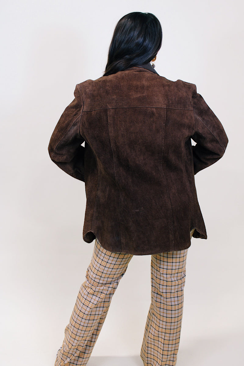 Women's or men's vintage 1970's Montgomery Ward label long sleeve brown suede jacket with popper buttons and dark brown leather trim. 