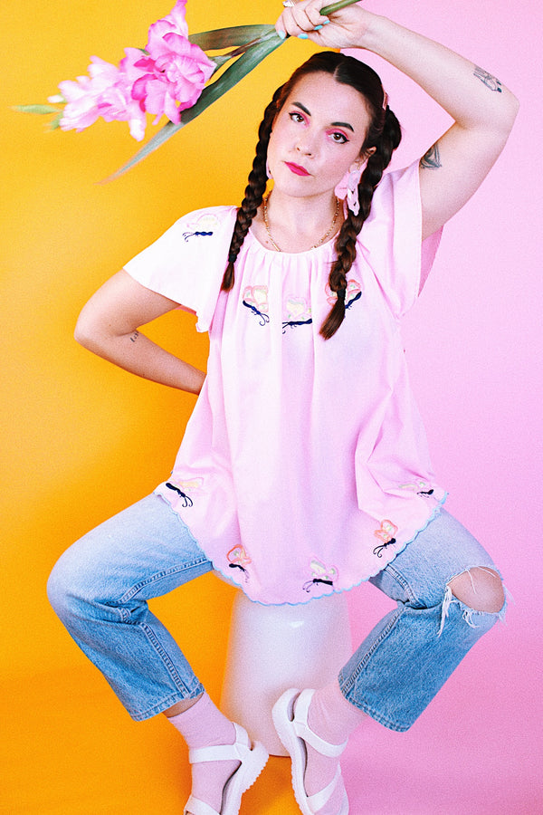 pink capped sleeve cotton blouse with embroidered butterflies throughout vintage 1960's