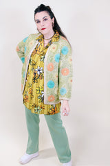 Women's vintage 1960's Hand Decorated Hand Loomed Fully Fashioned label cream colored wool open front cardigan with all over embroidered pastel flowers.