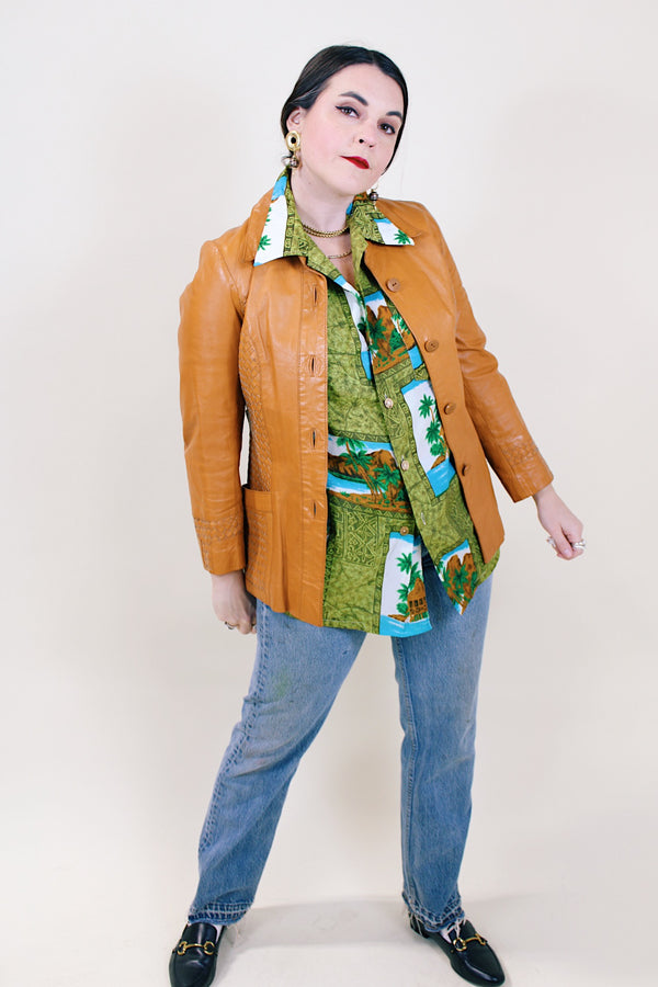 Women's vintage 1970's Suburban Heritage label long sleeve camel colored leather button up jacket.