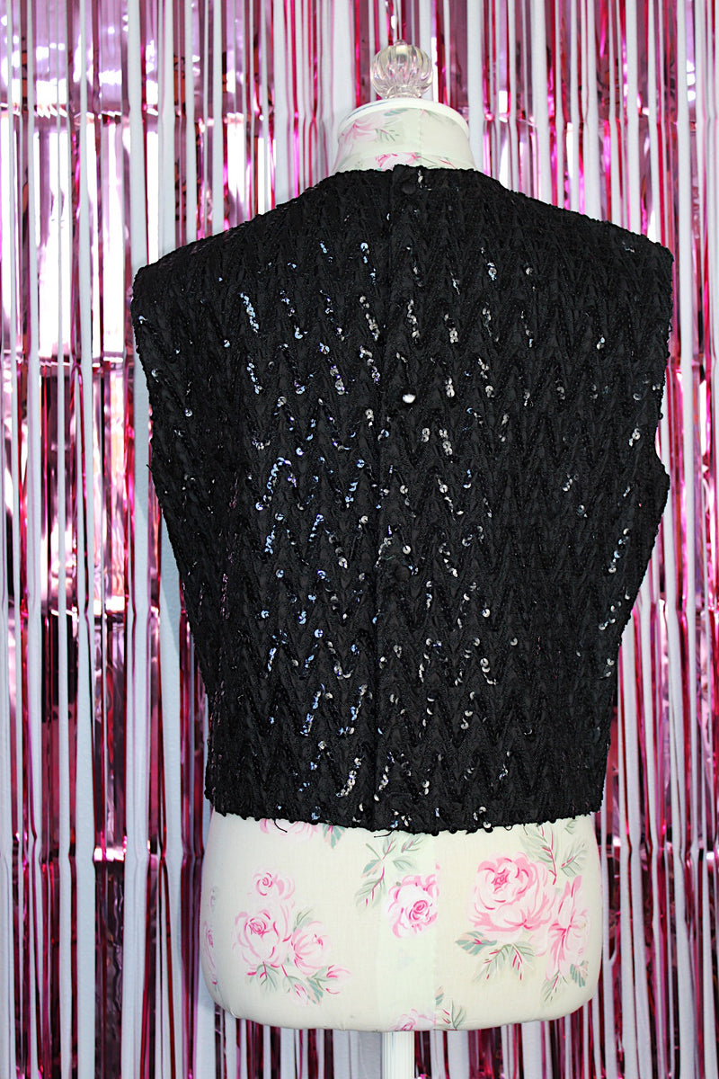 sleeveless black sequined top that buttons on the back cropped fit vintage women's 1960's
