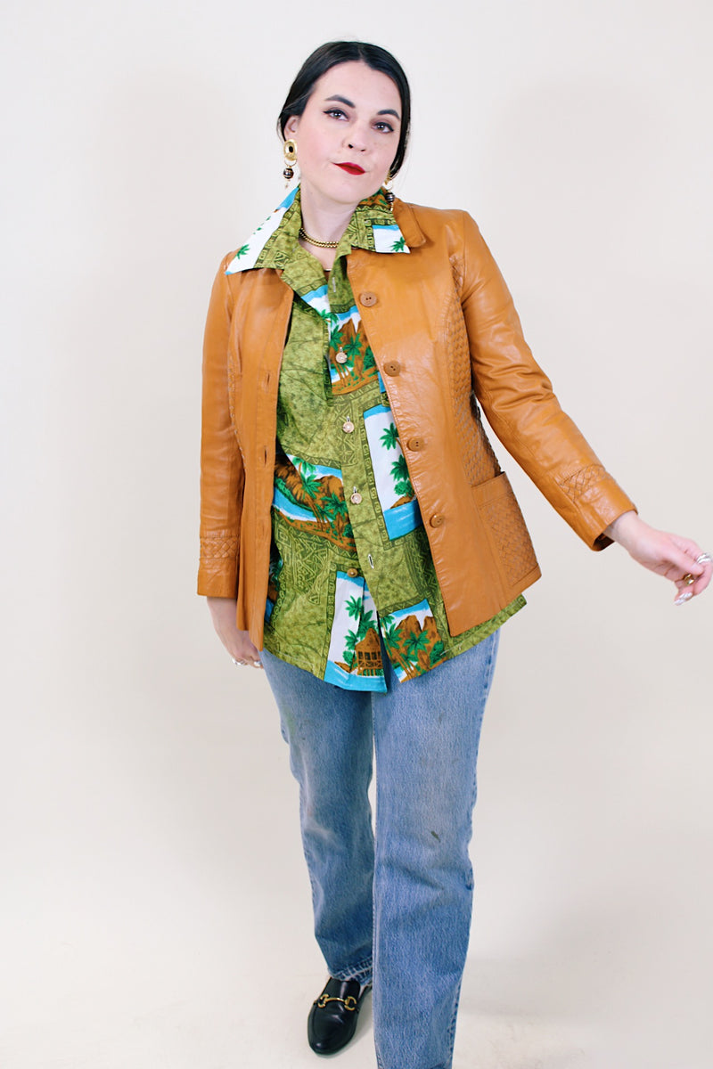 Women's vintage 1970's Suburban Heritage label long sleeve camel colored leather button up jacket.