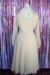 long sleeve midi length tan colored party dress with sheer arms and beads on shoulders vintage 1980's