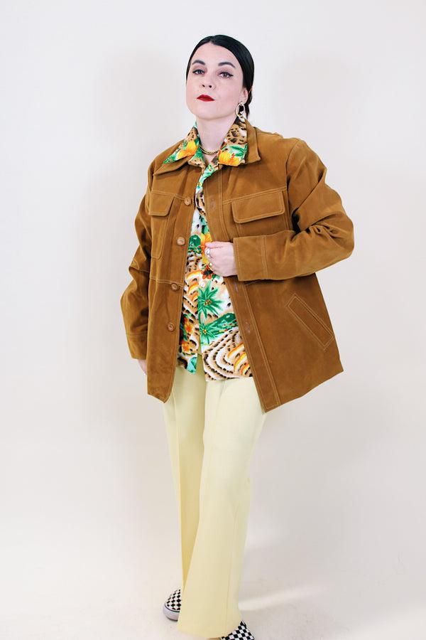 Men's vintage 1970's Pacific Trail Sportswear label long sleeve light brown colored PVC suede button up jacket with dagger collar.