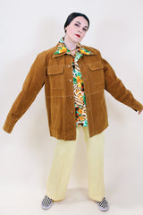 Men's vintage 1970's Pacific Trail Sportswear label long sleeve light brown colored PVC suede button up jacket with dagger collar.