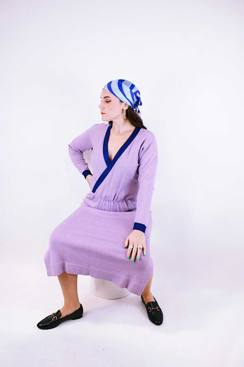  vintage 1980's midi length long sleeve wool knit dress with deep v neck in purple with darker purple trim