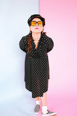 long sleeve knee length black dress with polka dots ruffle neckline and cuffs vintage 1970's