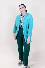 Women's vintage 1960's Boutique, Bullock's, Santa Ana label long sleeve blue open front long length cardigan with fringe trim in a wool material.