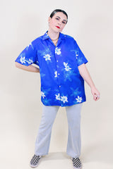Women's or men's vintage 1970's Davina Honolulu label short sleeve button up shirt with pointy collar in all over blue Hawaiian floral print in lightweight polyester.