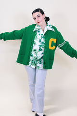 Men's or women's vintage 1980's Skookum Letterman label long sleeve bright green button up cardigan in wool material.