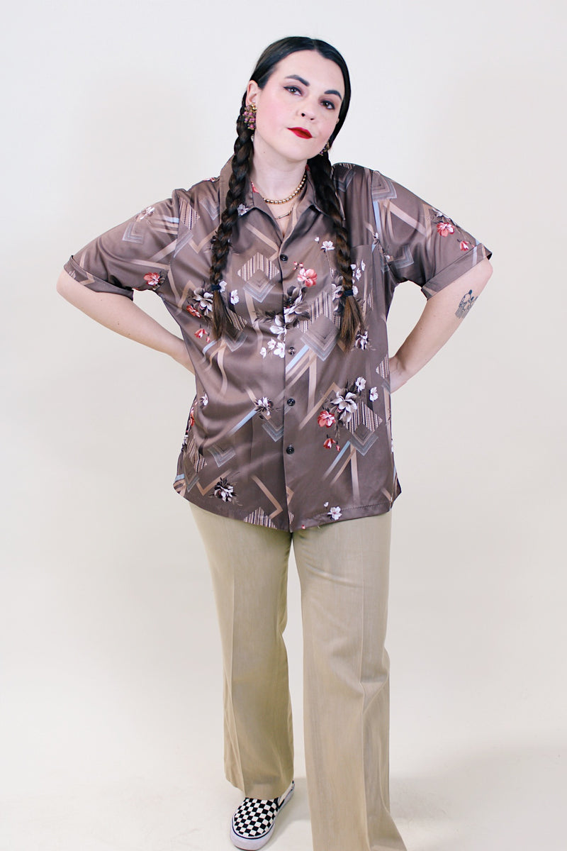 Women's or men's vintage 1970's Triumph of California label short sleeve button up shirt with pointy collar in polyester material. 