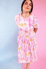 short sleeve midi length 1960's dress in white with pink and orange print