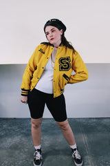 Women's vintage 1979 Nelson's Jackets, Portland, Oregon label long sleeve yellow and black wool letterman jacket. Popper buttons, patches, fully lined, knit ribbed trim. 