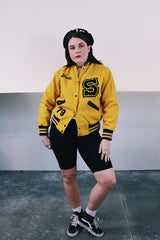 Women's vintage 1979 Nelson's Jackets, Portland, Oregon label long sleeve yellow and black wool letterman jacket. Popper buttons, patches, fully lined, knit ribbed trim. 