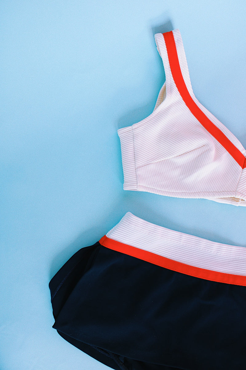 white, navy, and red vintage 1960's bikini with top and skort bottom