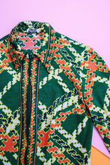 long sleeve cotton zip up blouse in green with yellow and orange print vintage women's 1960's
